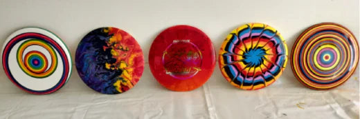 different disc golf discs dyed